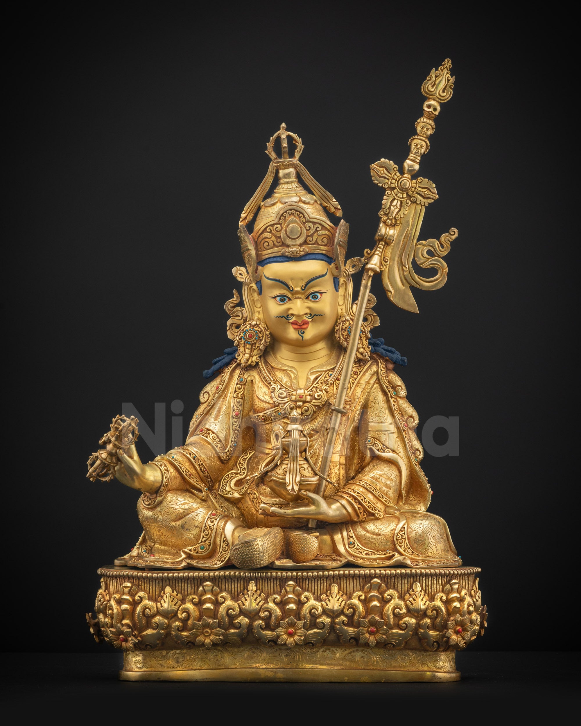 Front view Guru Rinpoche statue holding dorje and skull cup