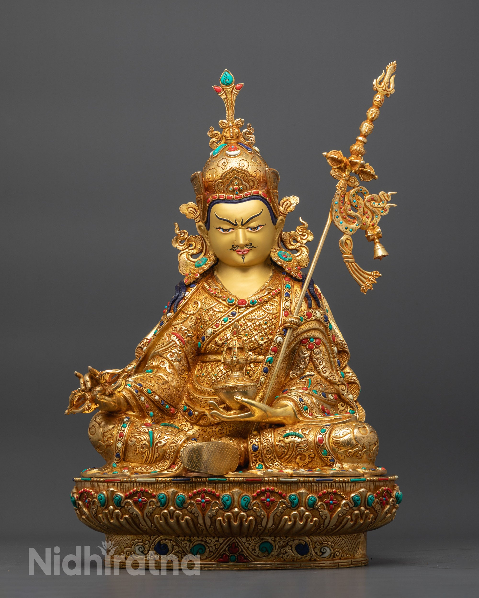 Front view Guru Rinpoche statue with gold-gilded face and lotus seat detailed carving