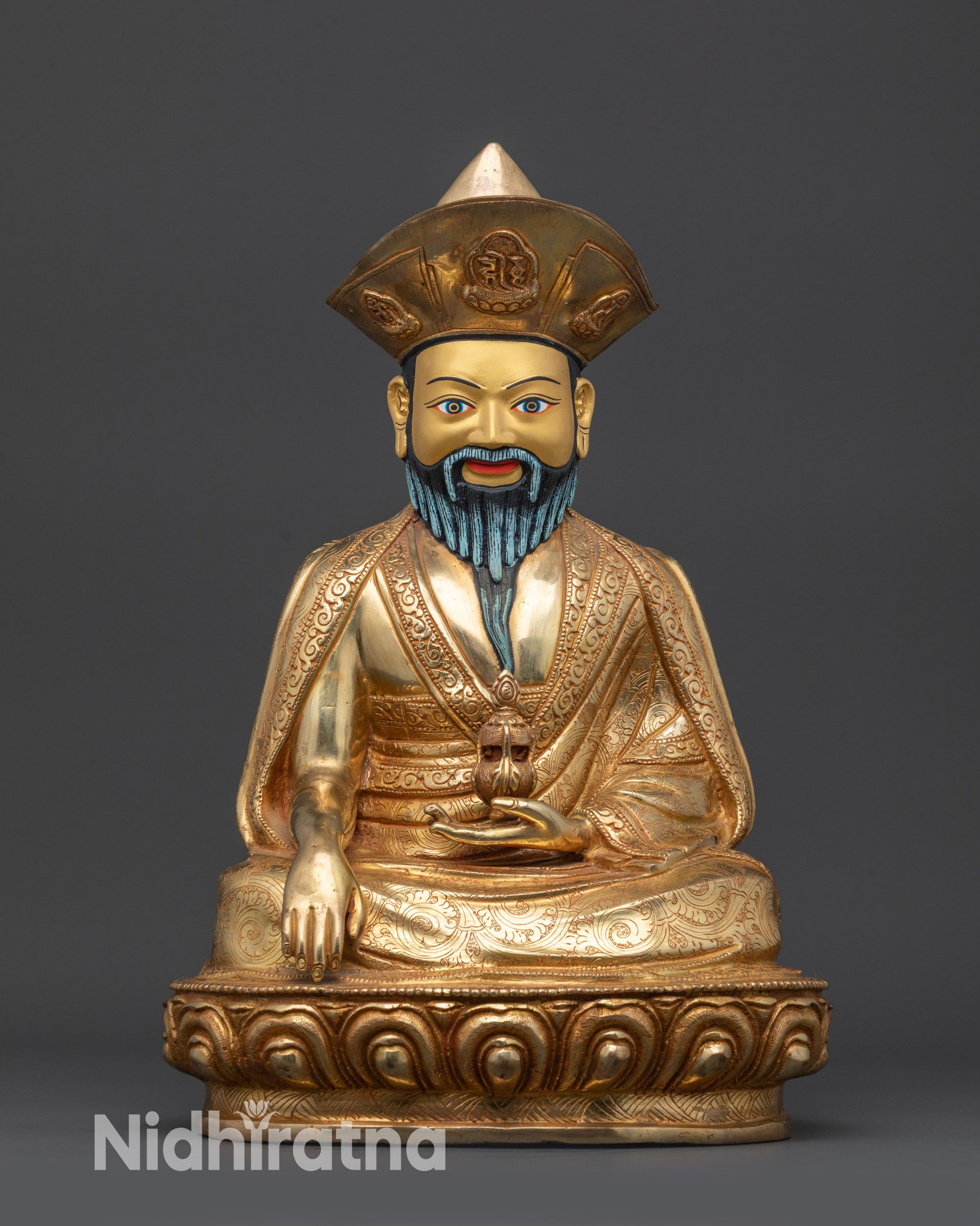 Front view Guru Shapdum statue on lotus seat with gold-gilded face and detailed robes
