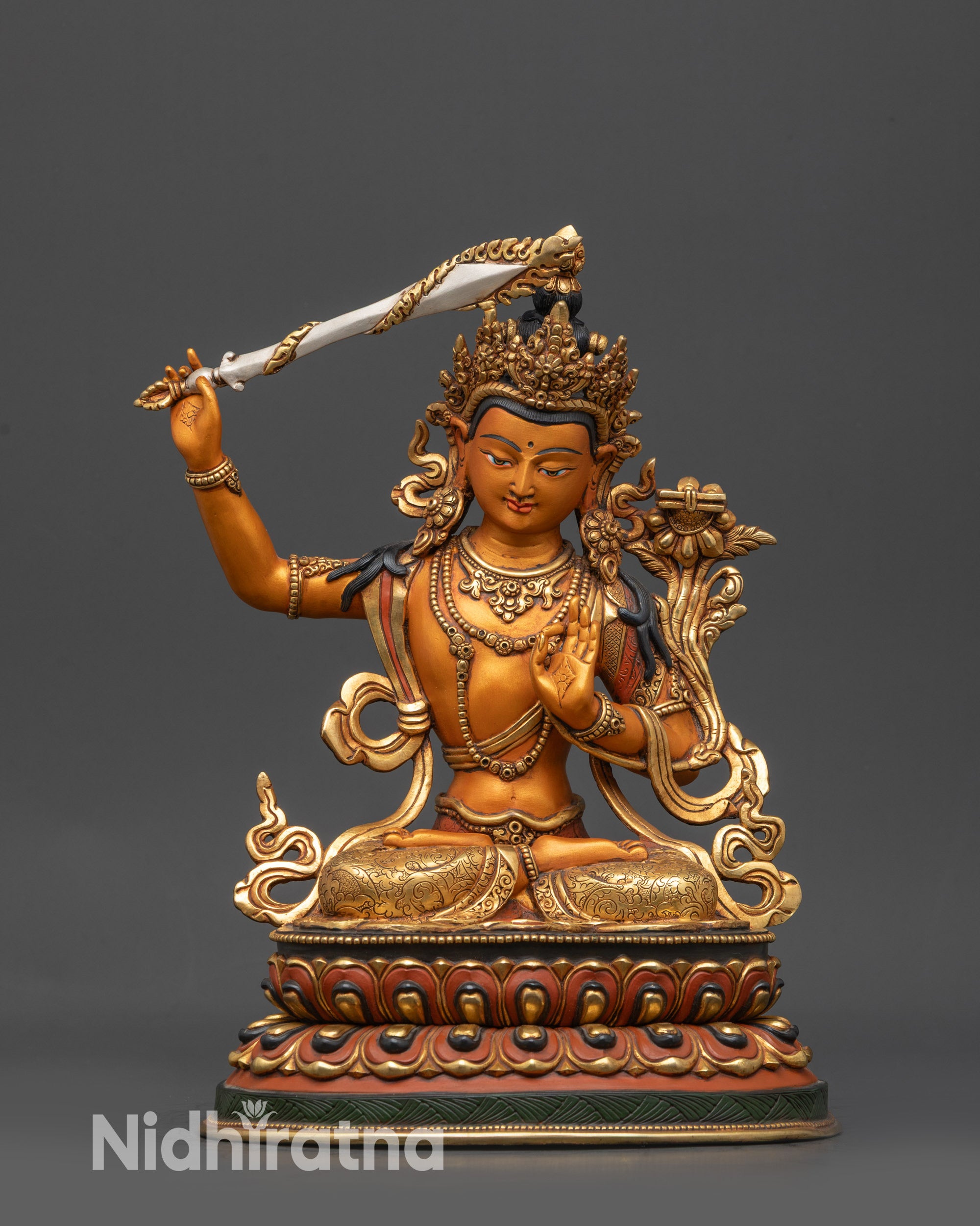 Front view Hand-painted Manjushri Statue on orange-hued base with gold-plated robe