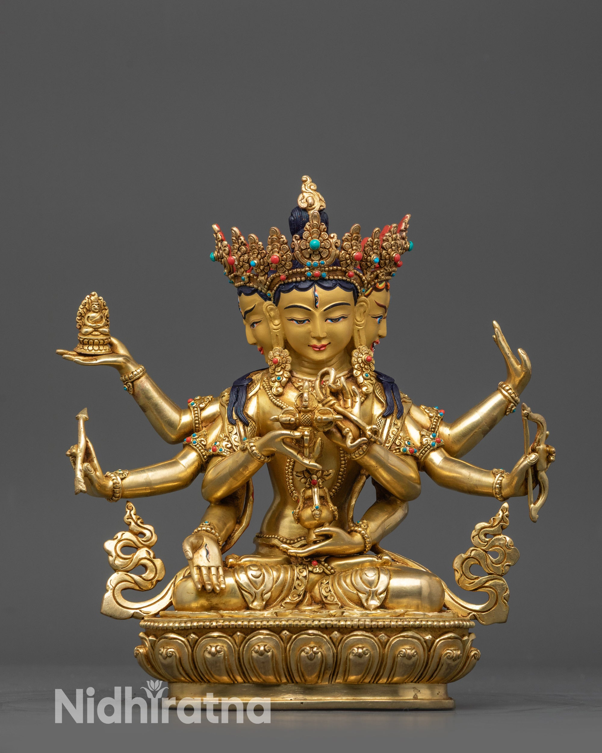 Front view Healing Deity Namgyalma statue with three gold-gilded faces and eight arms