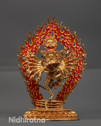 Front view Hevajra Statue with gold-gilded face, crown, robes and radiant halo
