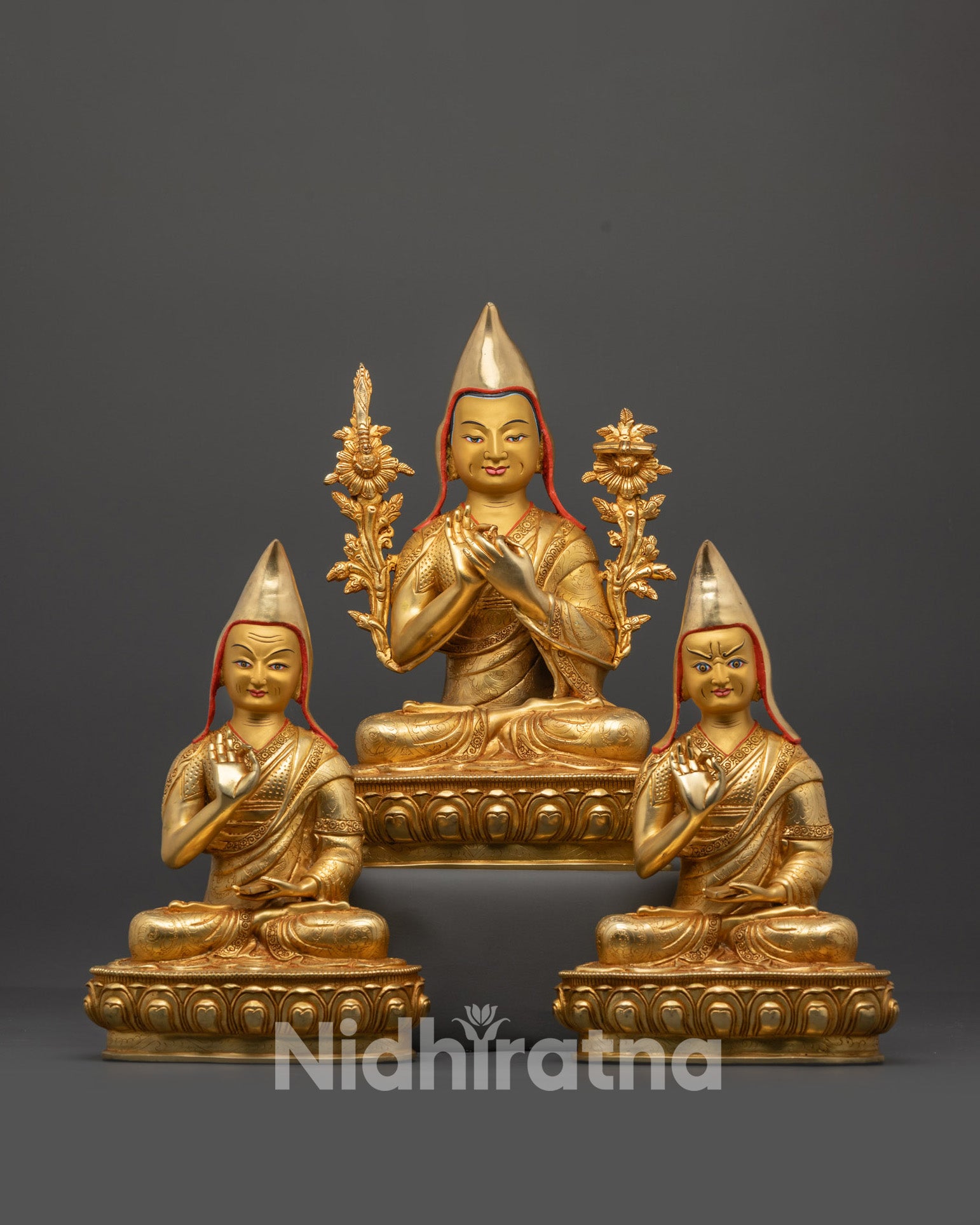 Front view Lama Je Tsongkhapa set with disciples gold-gilded faces on lotus seats
