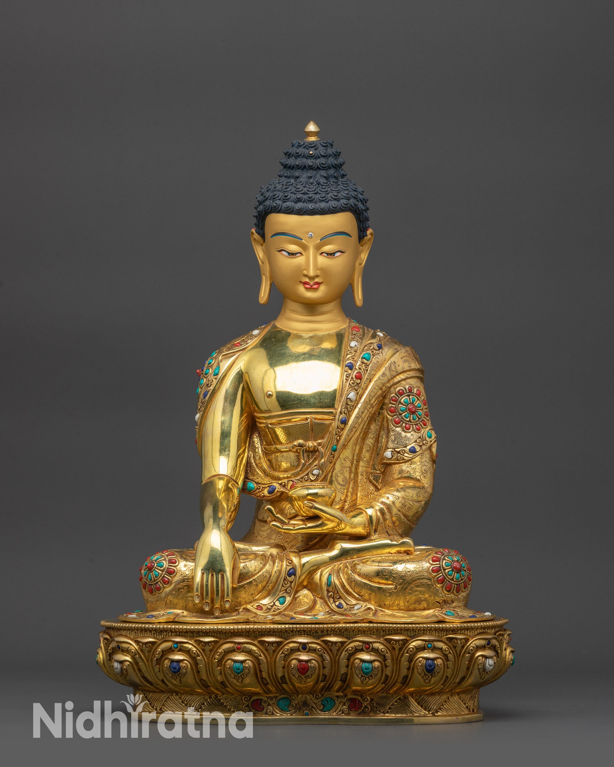 Front view Lord Gautama Buddha Statue showing gold-gilded Shakyamuni in lotus pose