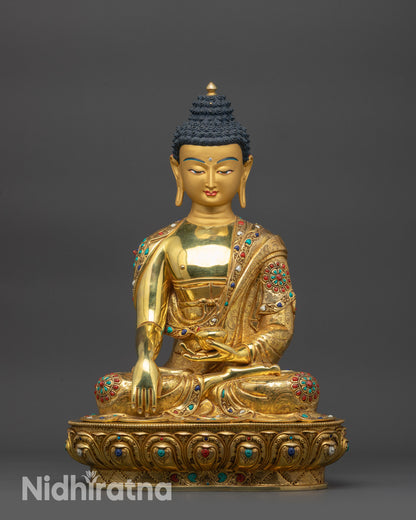 Front view Lord Gautama Buddha Statue showing gold-gilded Shakyamuni in lotus pose