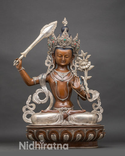 Front view Manjushree Bodhisattva statue in Nepalese copper with wisdom sword and lotus