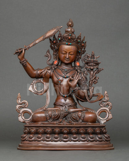 Front view Manjushri Buddha statue, handmade Nepalese copper with oxidized finish
