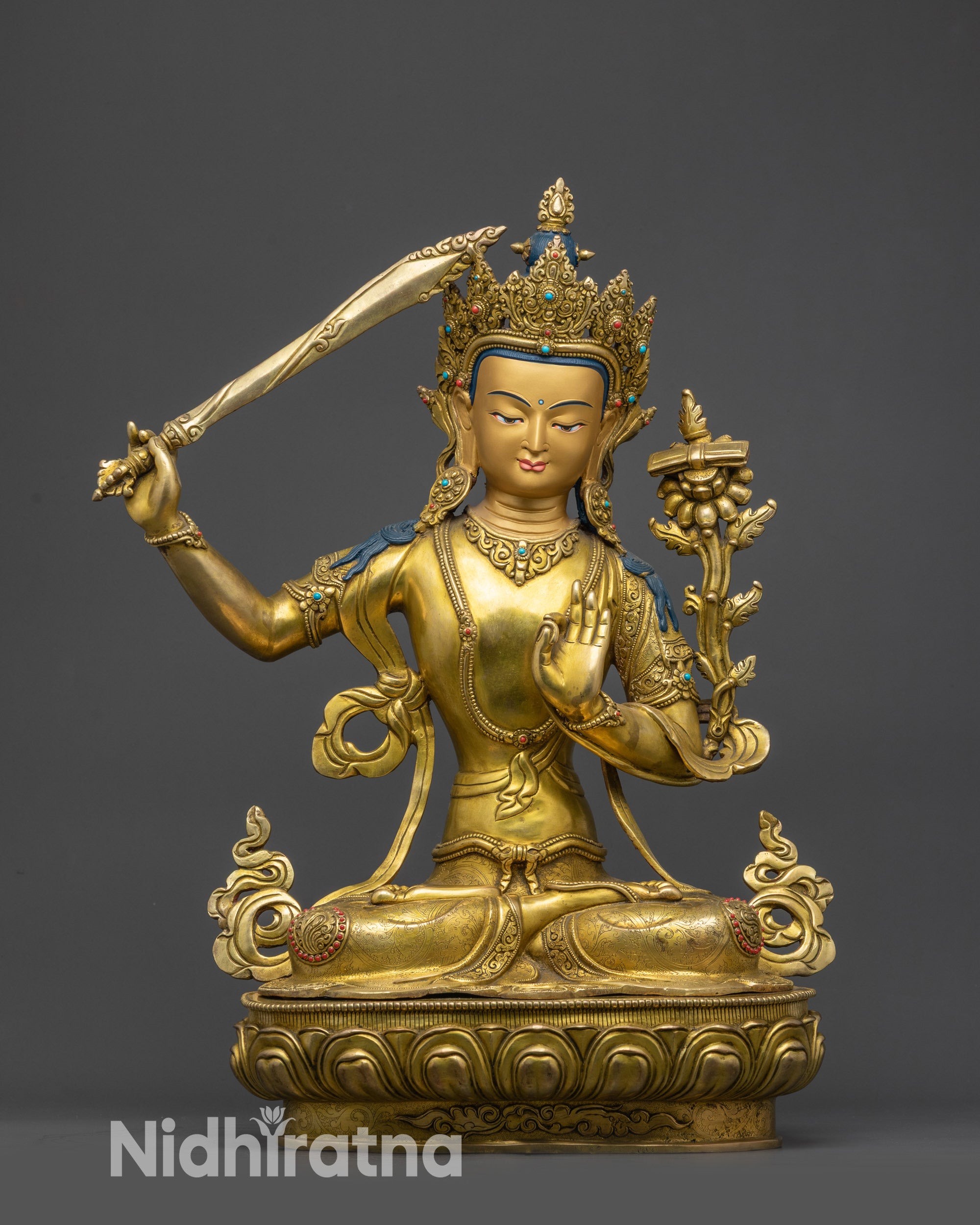 Front view Manjushri Statue on gold fire-gilded base with lotus seat and Dharma wheels
