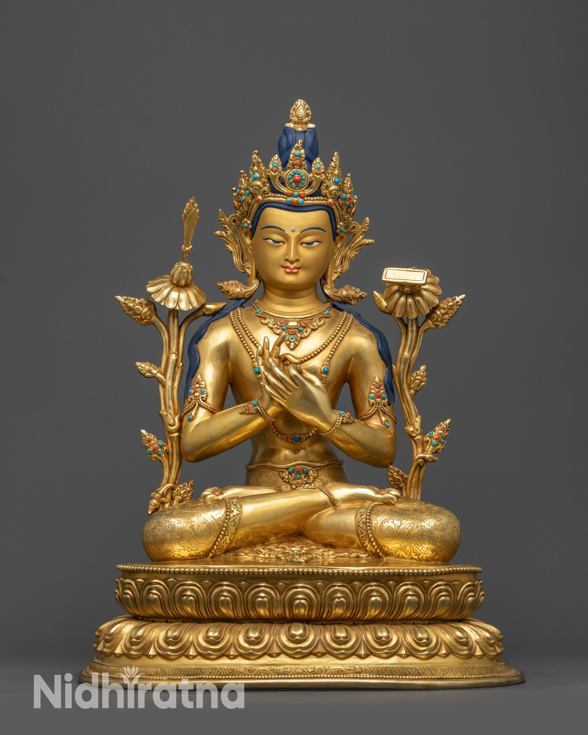 Front view Manjushri Statue on lotus seat with gold-gilded face and crow