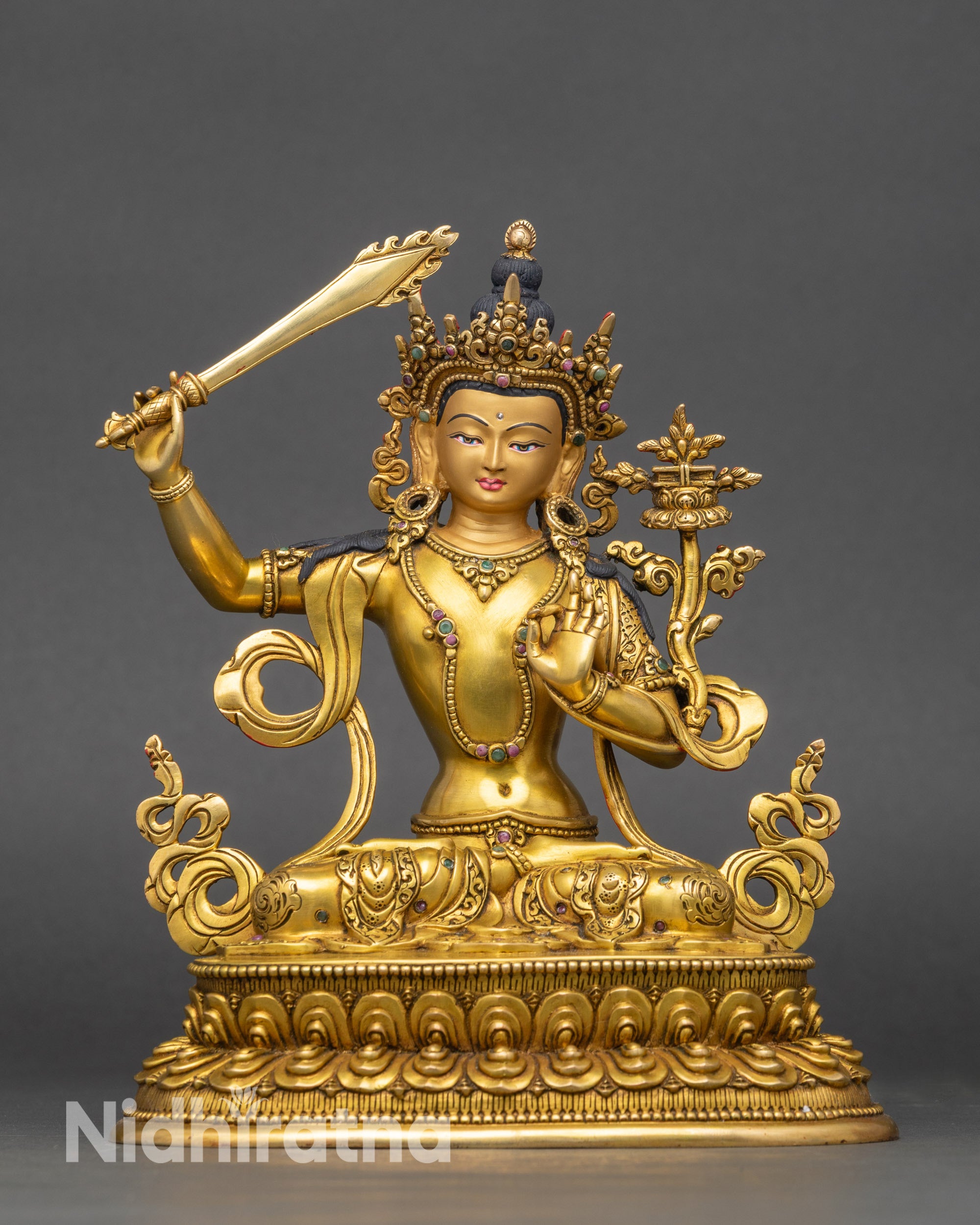 Front view Manjushri statue gold-gilded copper with lotus pedestal and Vajrayana details