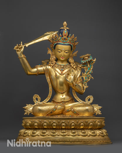 Front view Manjushri statue seated on lotus with gold-gilded Bodhisattva details
