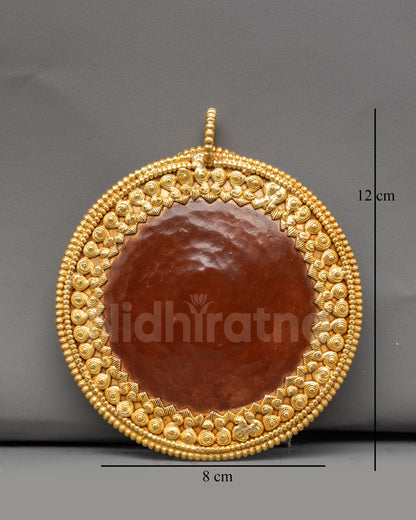 Front view Melong ritual mirror, handcrafted in copper with gold plating from Nepal
