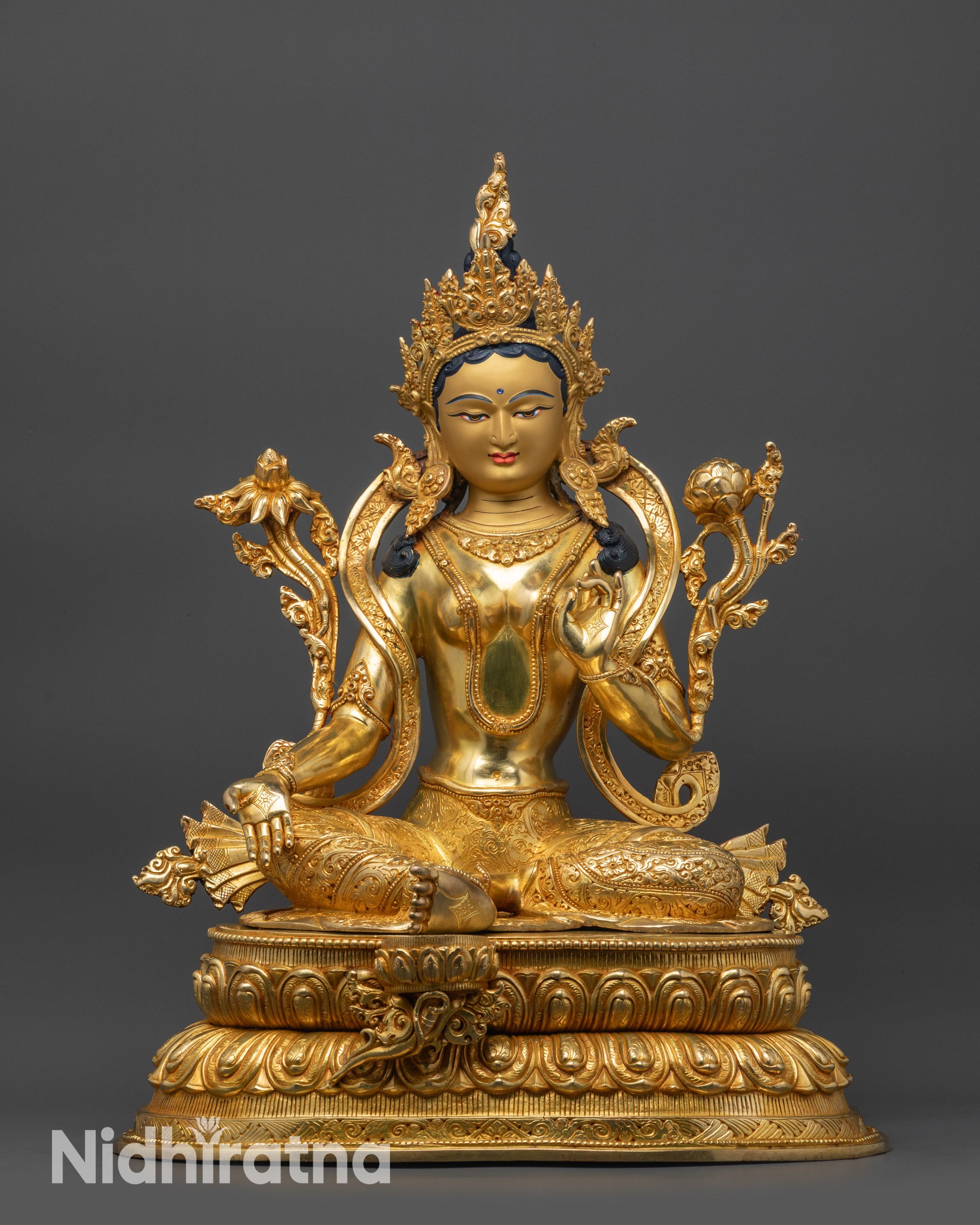 Front view Mother Tara Statue gold-gilded face seated on lotus base
