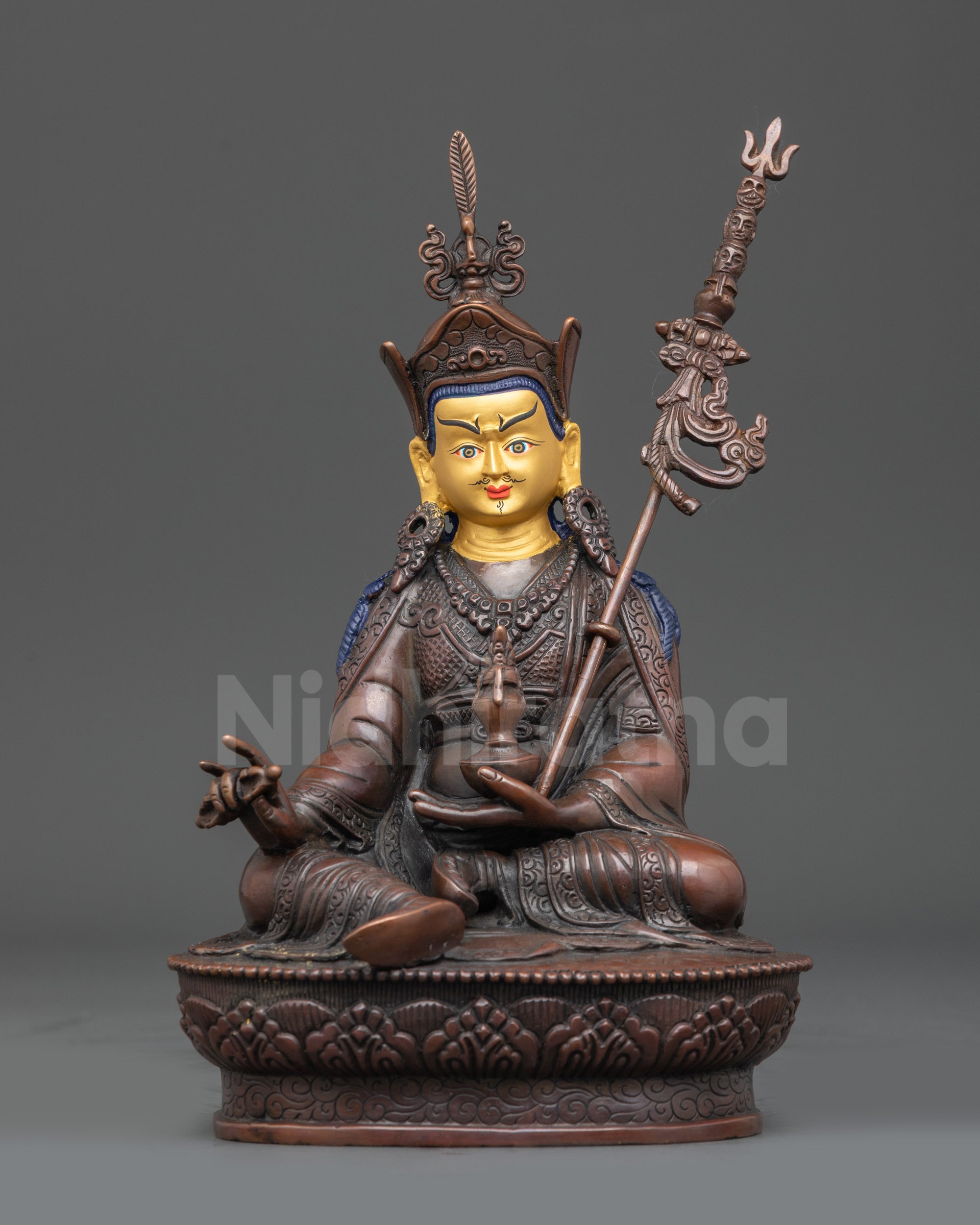 Front view Nepalese Guru Rinpoche statue with lotus seat and gold-gilded face
