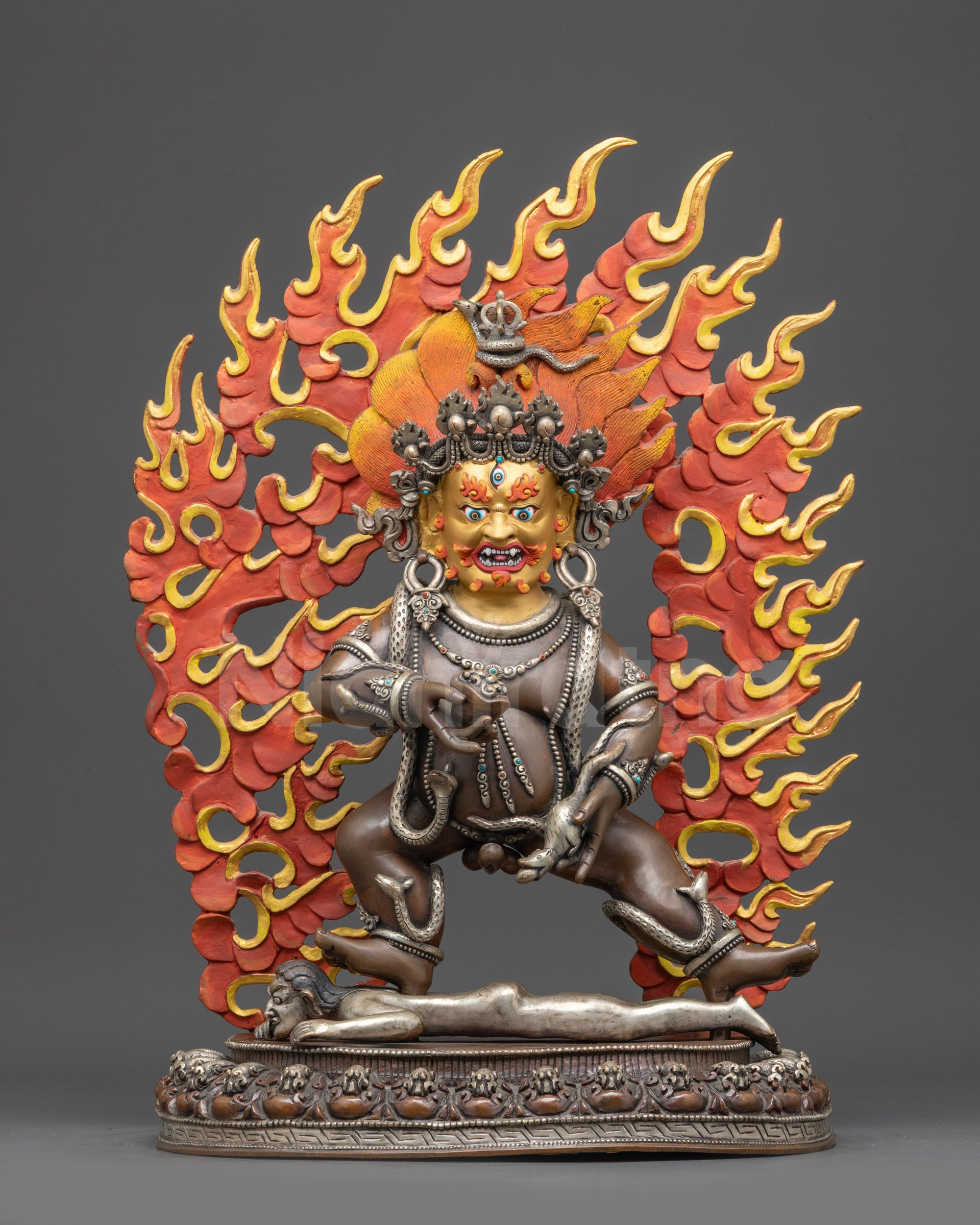 Front view Oxidized Black Dzambhala statue on lotus with wrathful pose and gold face
