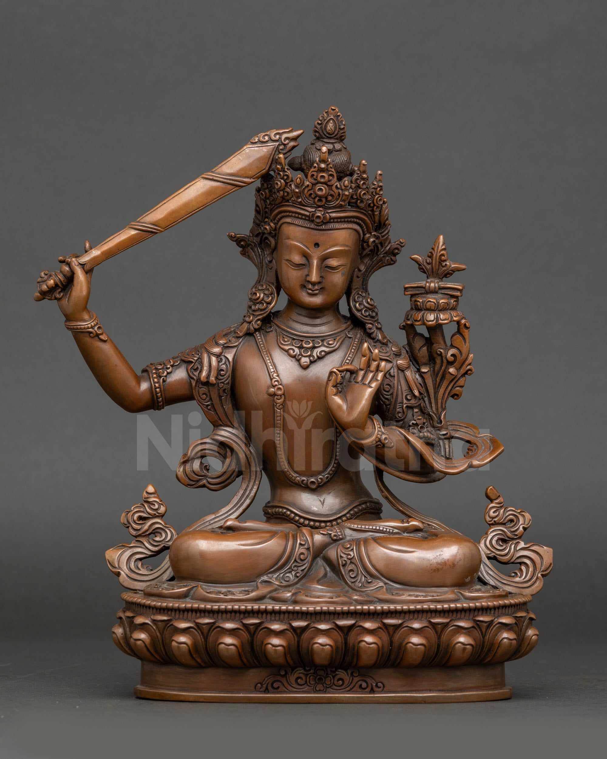 Front view – Oxidized Himalayan Manjushri Bodhisattva statue seated on lotus with flaming sword and Prajnaparamita Sutra, handcrafted Nepalese sacred art.