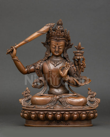 Front view – Oxidized Himalayan Manjushri Bodhisattva statue seated on lotus with flaming sword and Prajnaparamita Sutra, handcrafted Nepalese sacred art.