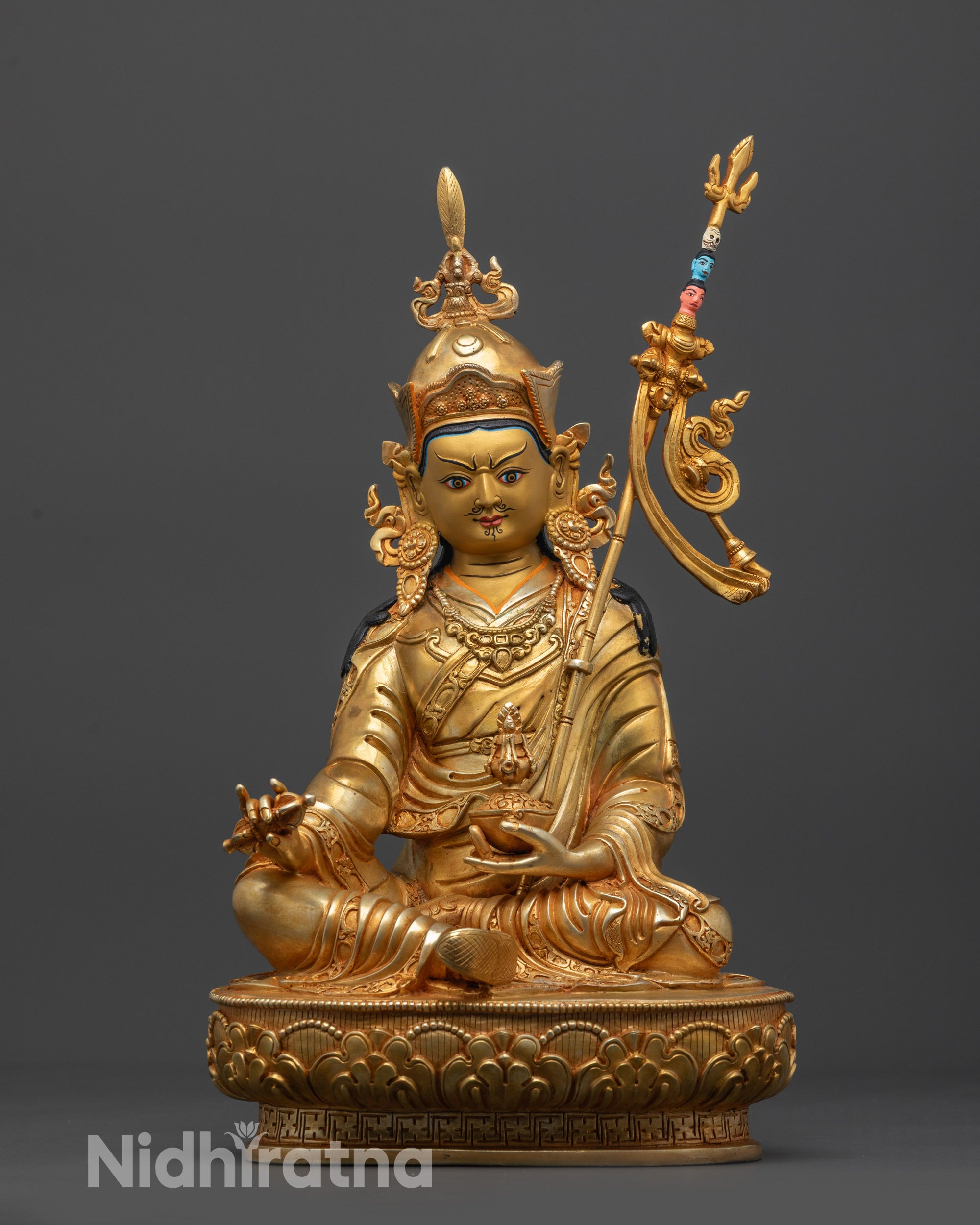 Front view Padmasambhava Guru Rinpoche Statue with gold-gilded face and lotus seat

