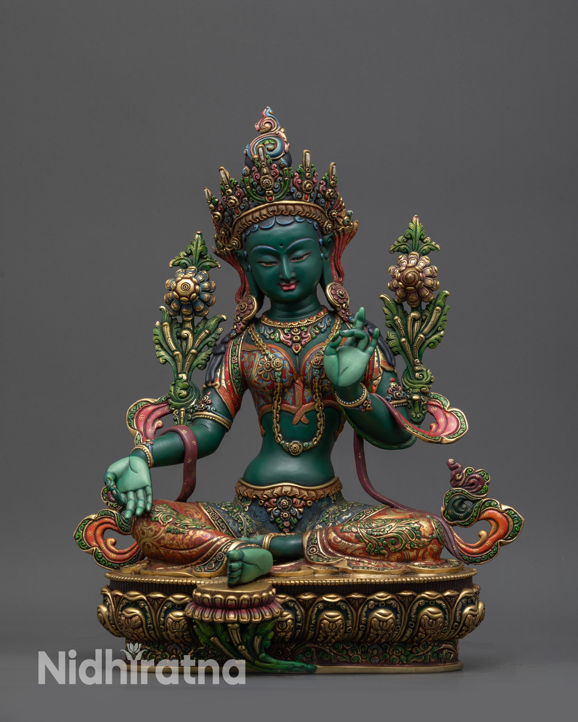 Front view Premium Green Tara Statue seated on vibrant gold-gilded lotus with extended foot
