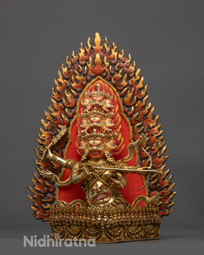 Front view Rahula statue with nine heads and flaming halo
