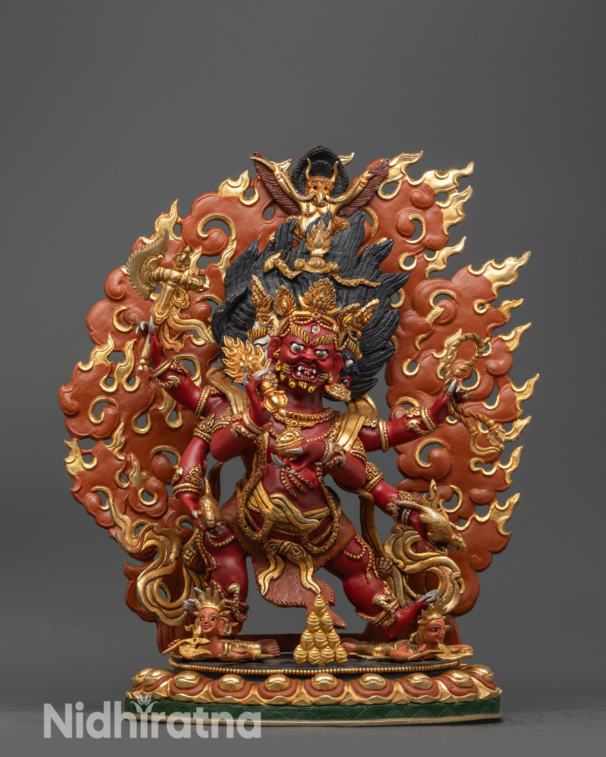 Front view Red Dzambhala standing statue with gold-plated robe and vibrant red body
