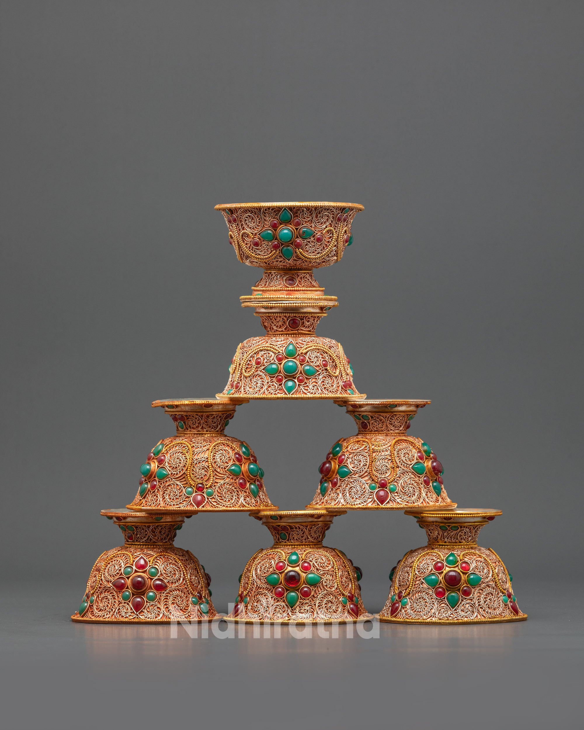 Front view Set of Seven Tibetan Water Offering Bowls with gold-plated filigree design