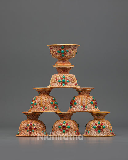 Front view Set of Seven Tibetan Water Offering Bowls with gold-plated filigree design