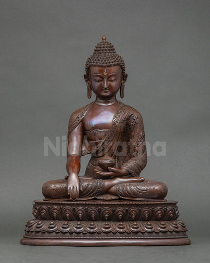Front view Shakyamuni Buddha statue earth touching mudra oxidized copper Nepal