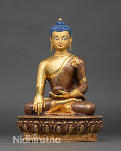 Front view Shakyamuni Buddha statue gold detailing with monk bowl on lotus base
