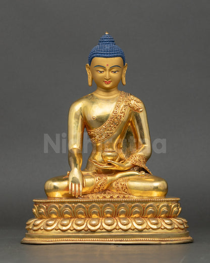 Front view Shakyamuni Buddha statue, gold gilded copper, seated on lotus with begging bowl