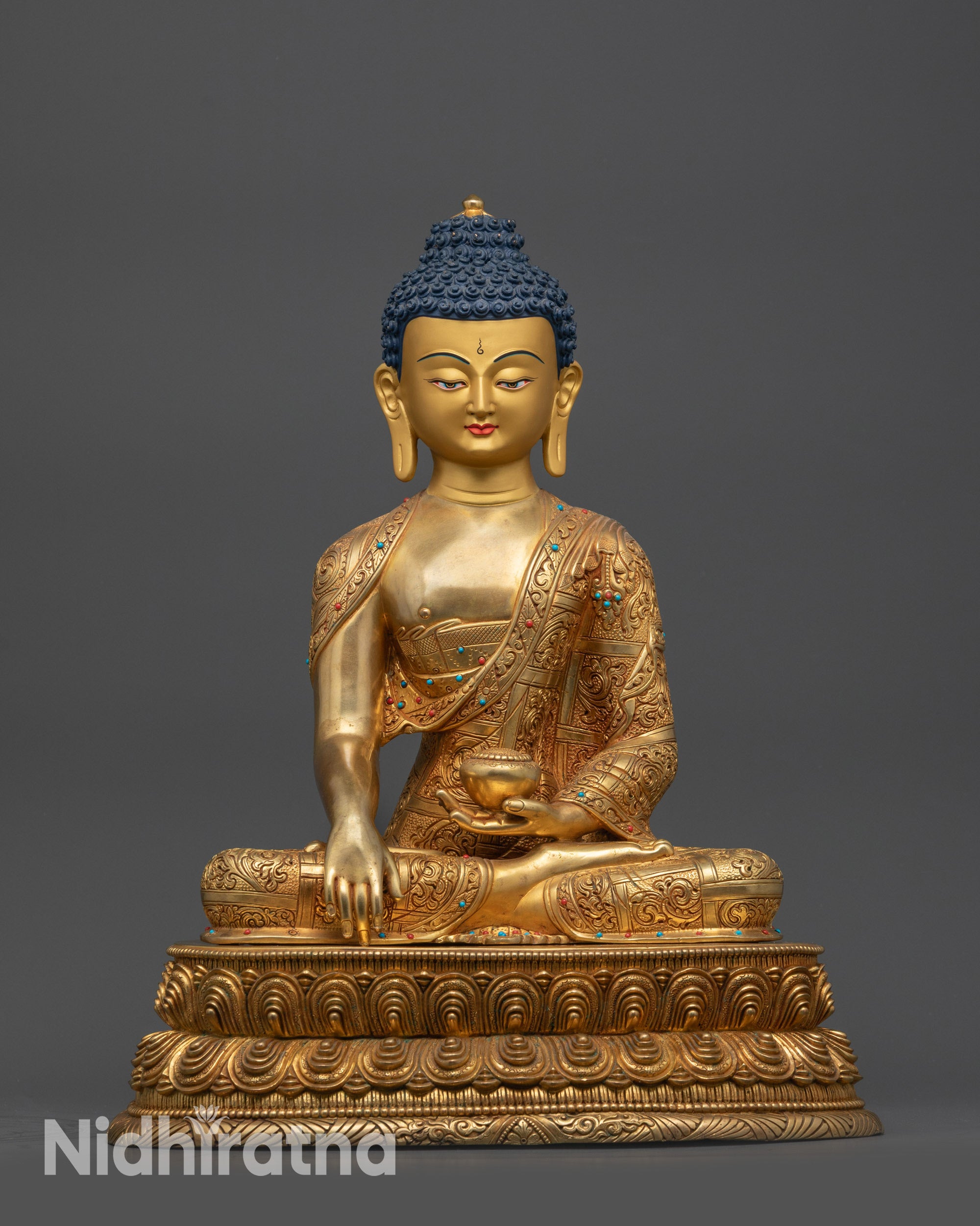 Front view Shakyamuni Buddha statue with gold-gilded face and lotus pedestal from Nepal
