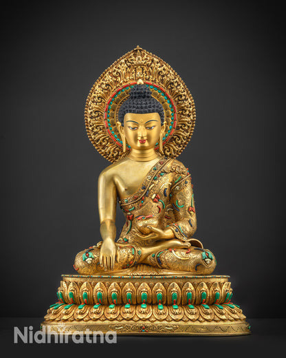 Front view Shakyamuni Buddha statue with gold gilded face and serene expression
