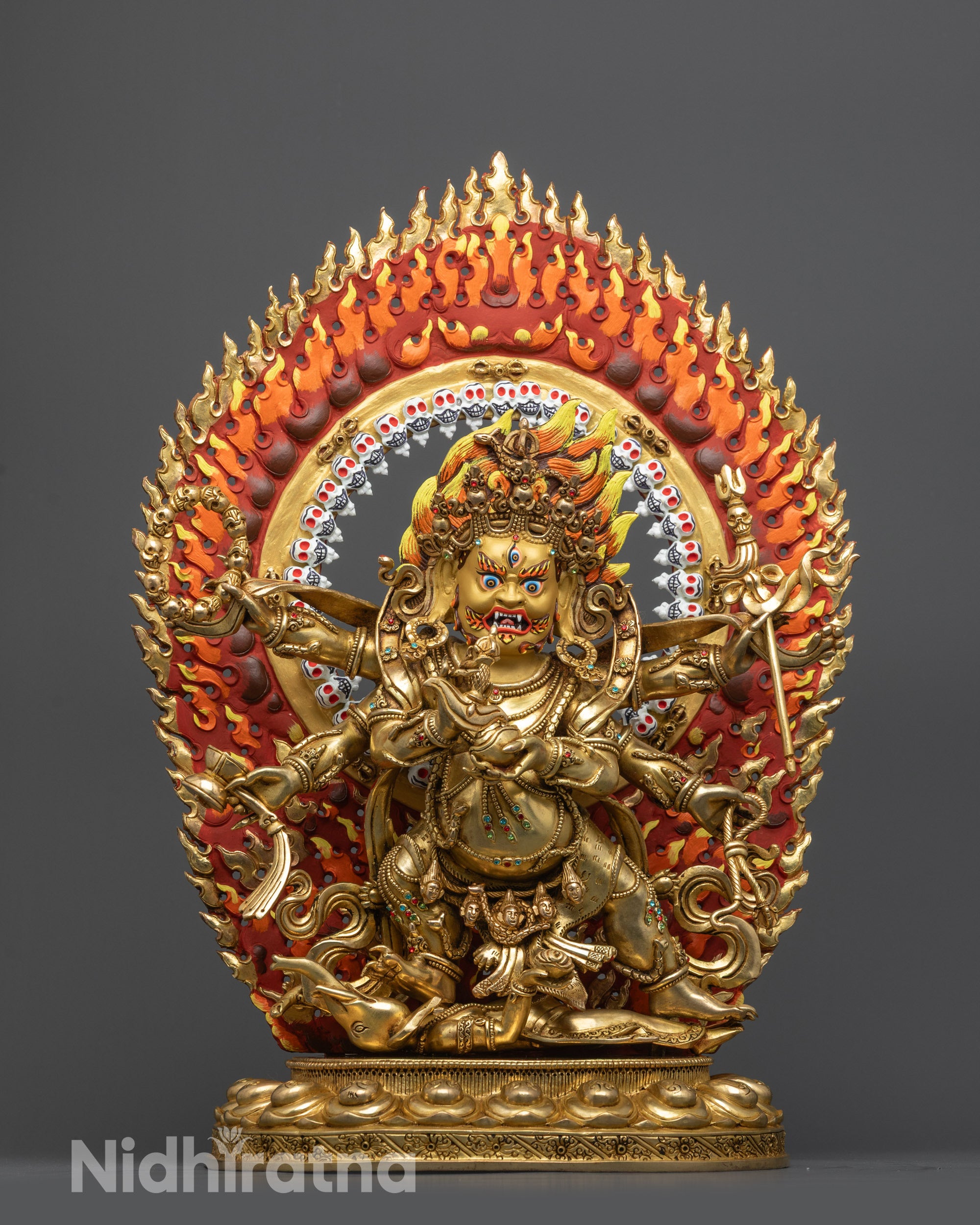 Front view Six-Armed Mahakala Statue with gold gilded face and blazing skull halo
