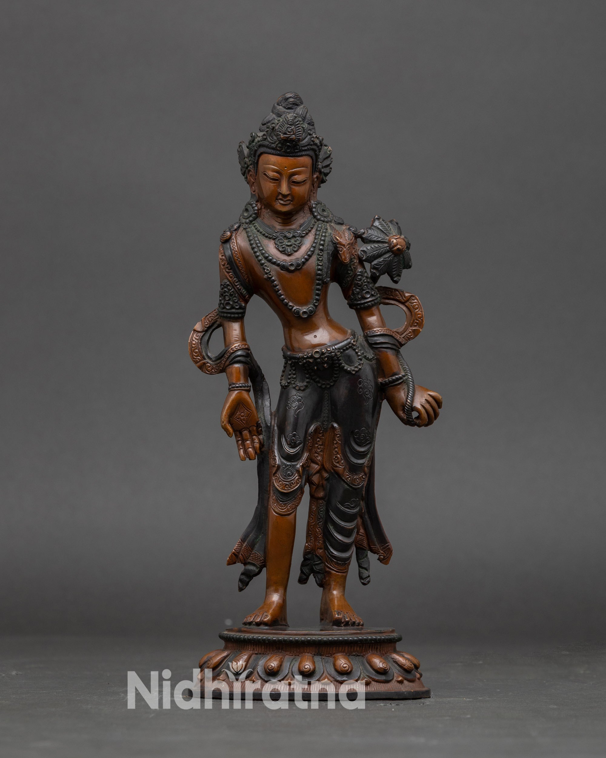 Front view Standing Chenrezig statue in Nepalese copper with lotus pedestal and Utpala flower
