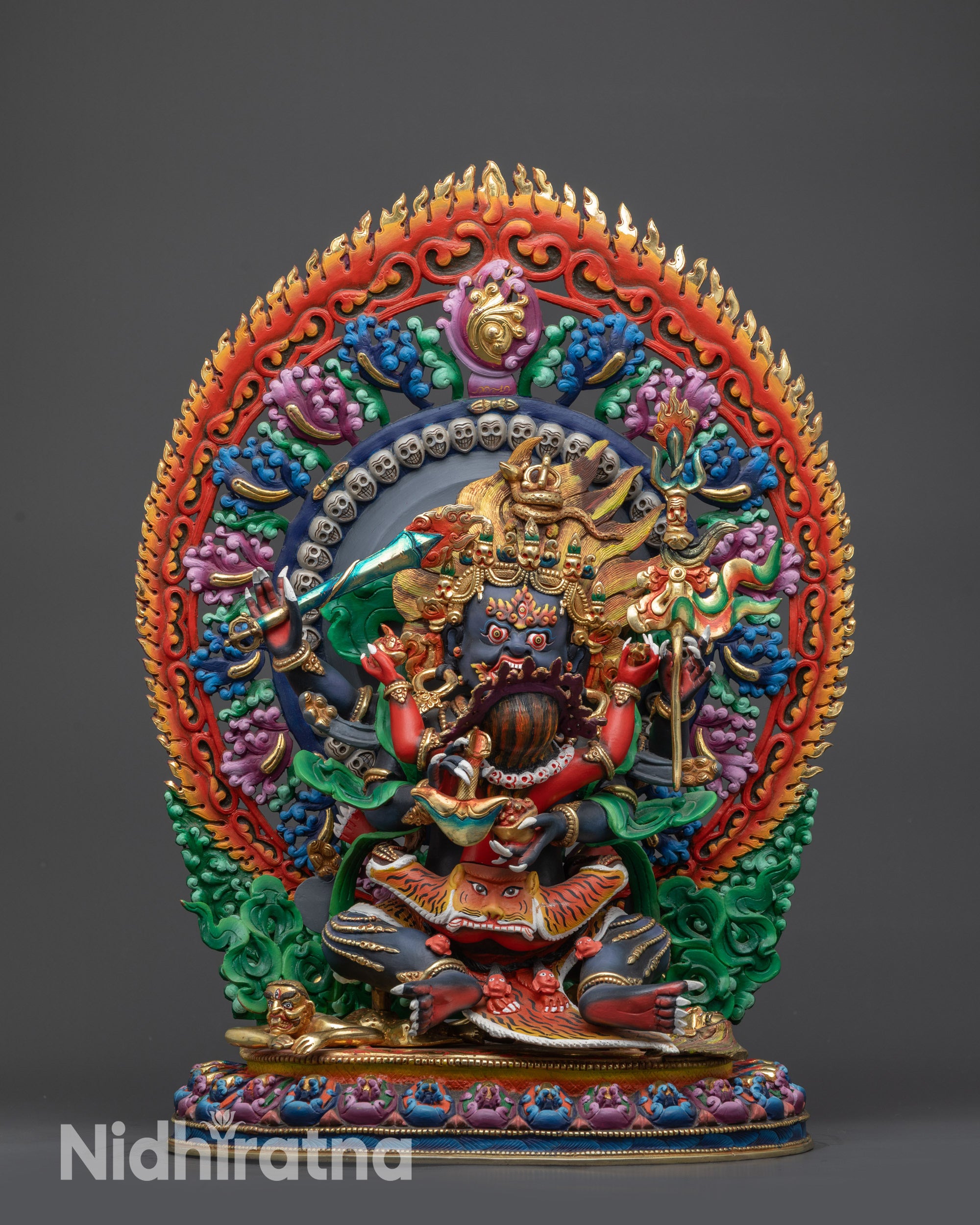 Front view Tibetan Four-Armed Mahakala Statue with floral halo and lotus seat