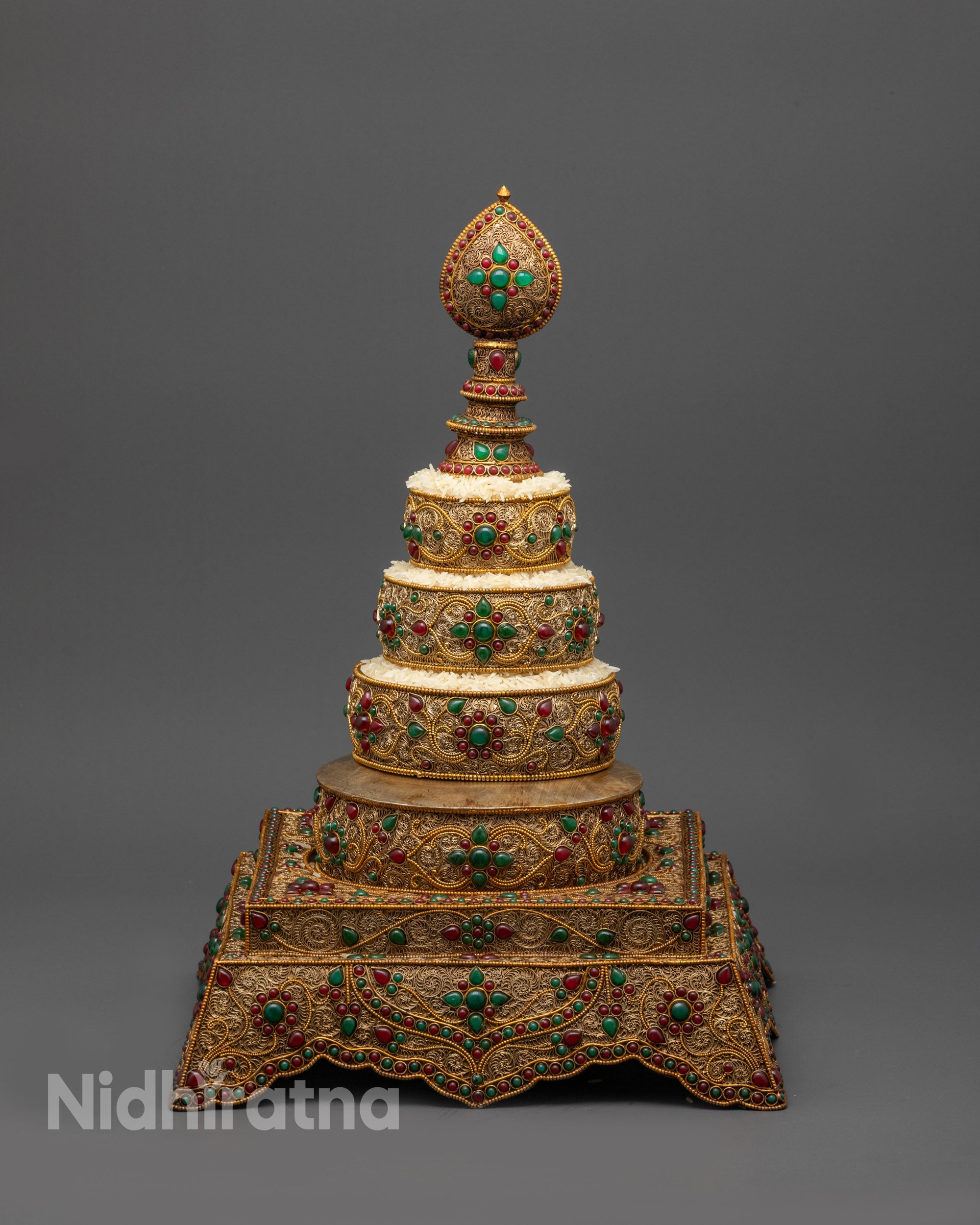 Front view Tibetan Mandala with gold-plated filigree and ruby emerald stones
