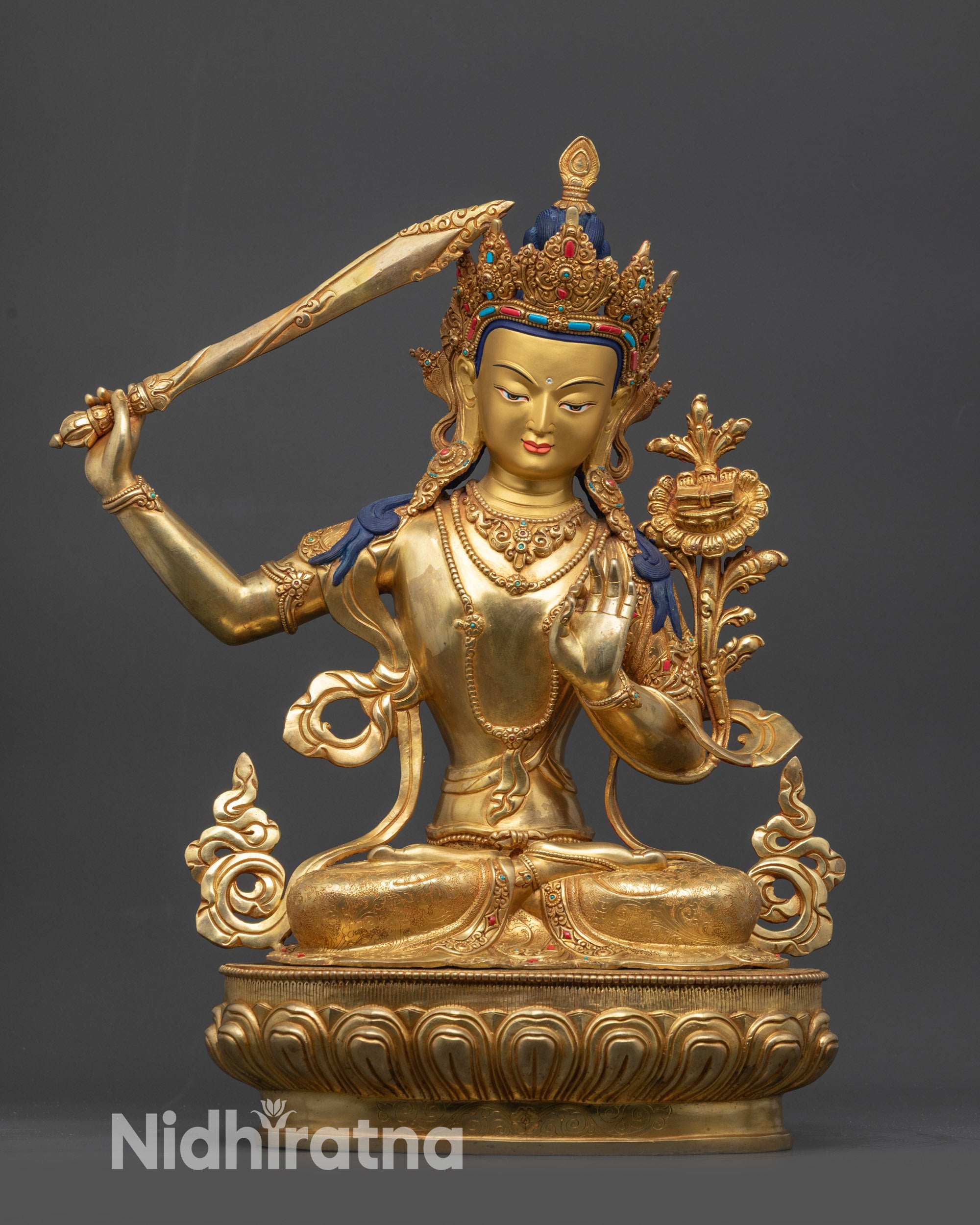 Front view Tibetan Manjushri statue on lotus seat for meditation and home altar
