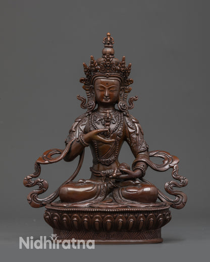 handmade Buddhist deity with vajra and bell