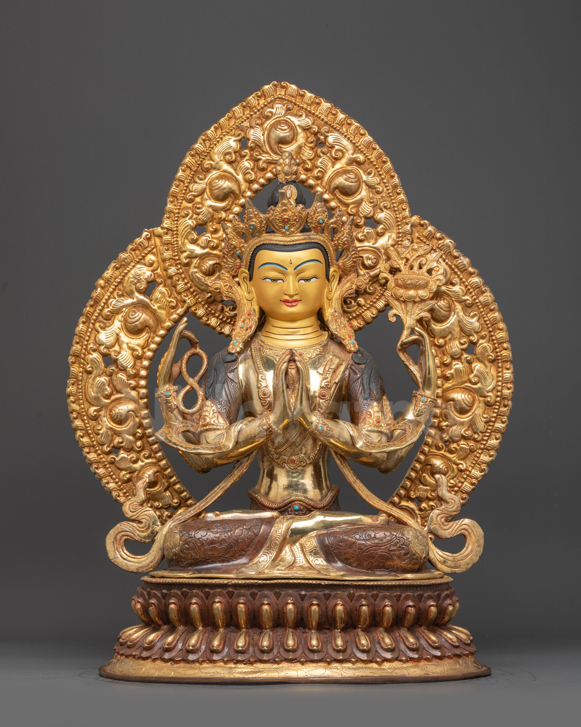 Front view Traditional Chenrezig Statue with gold-gilded face and four arms
