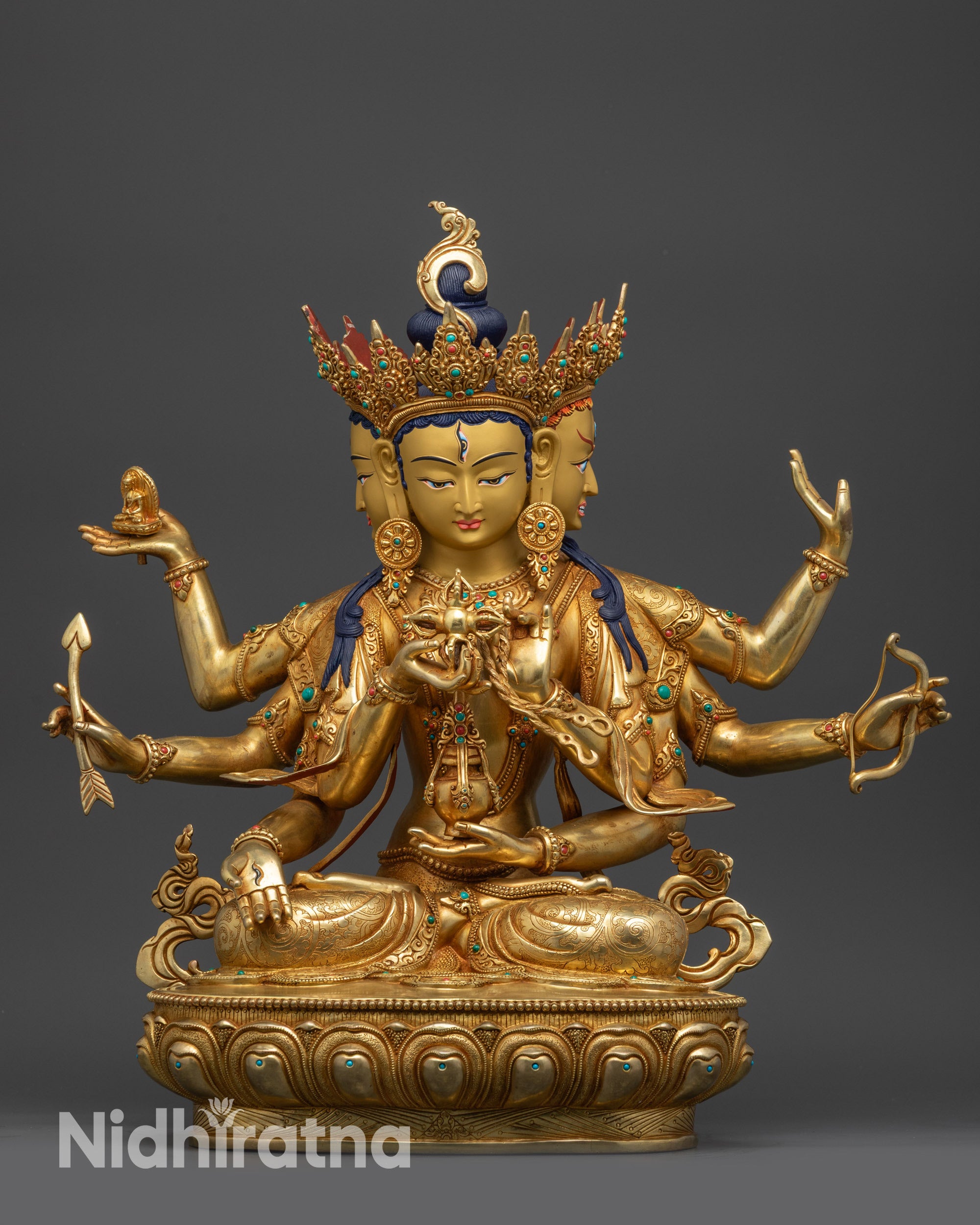 Front view Ushnishavijaya Namgyalma statue with gold-gilded faces and lotus seat