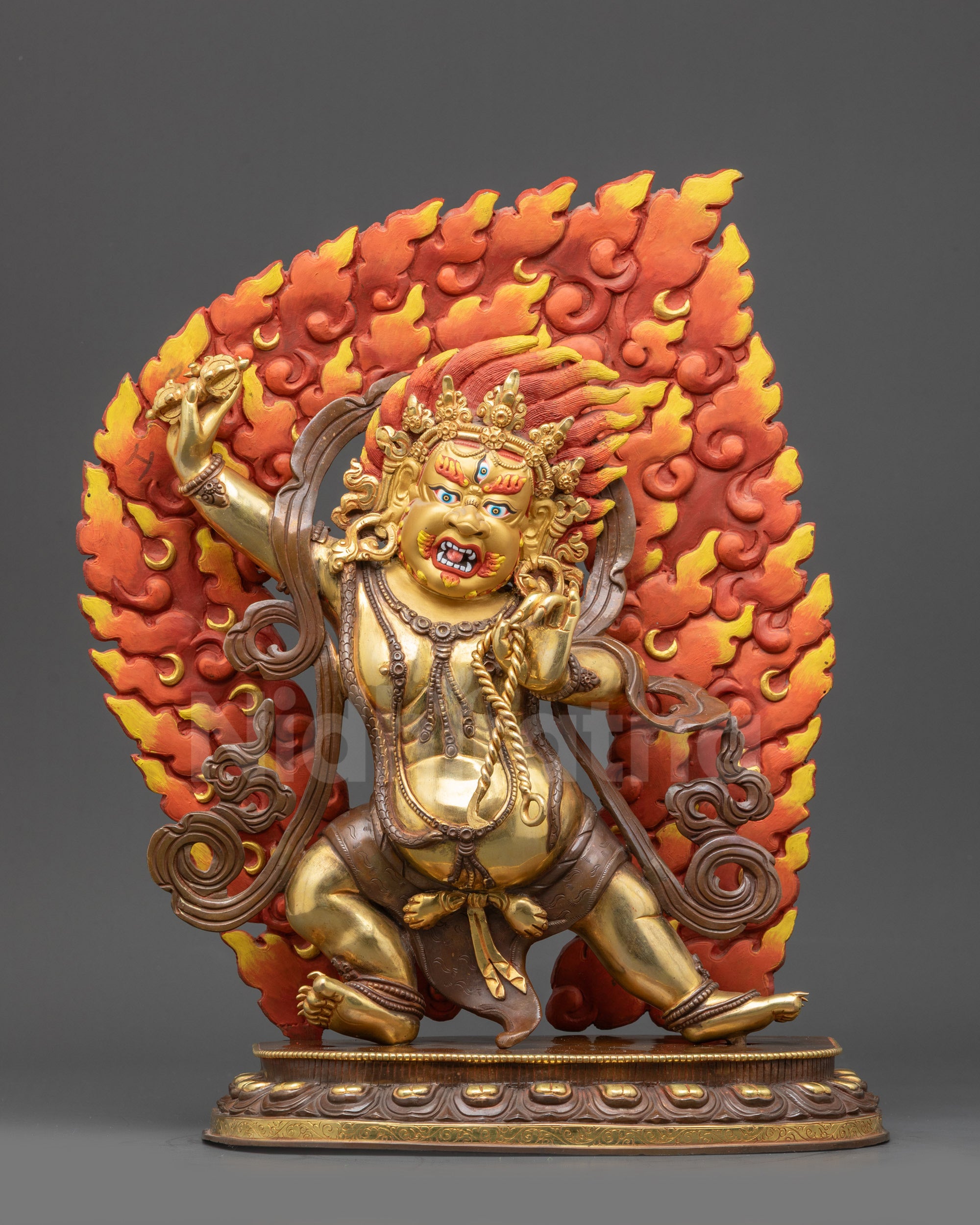 Front view Vajrapani Buddhist idol statue with gold-gilded face and wrathful halo