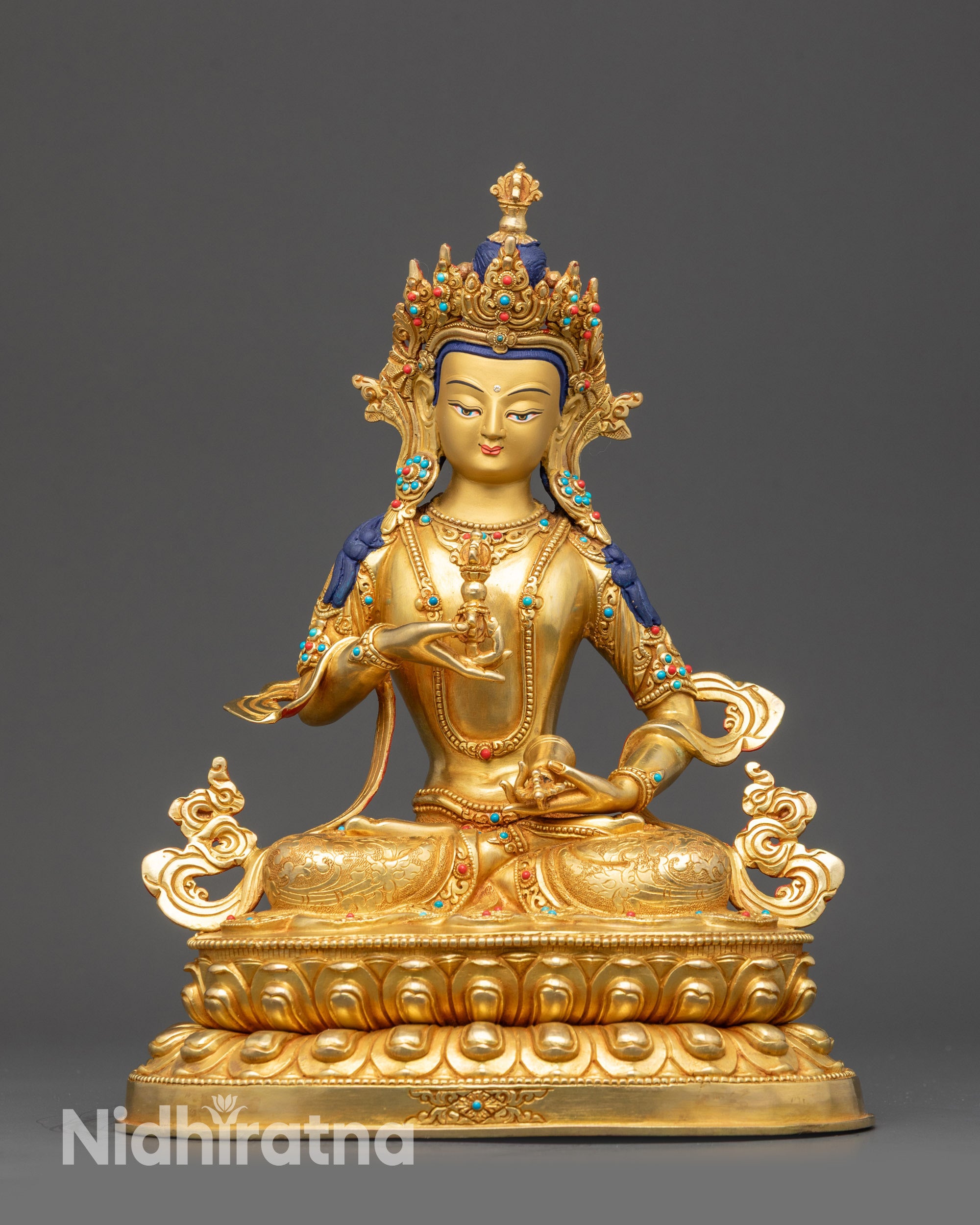 Front view Vajrasattva Statue on lotus seat with gold-gilded base and calm expression
