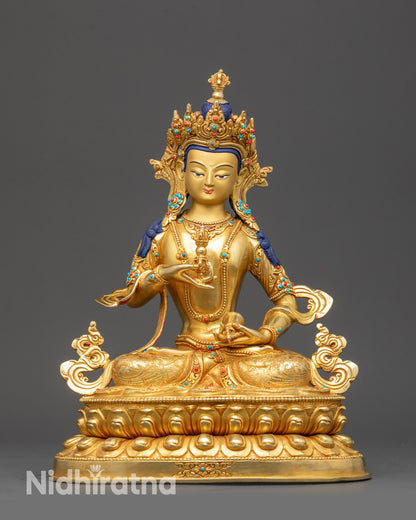 Front view Vajrasattva Statue on lotus seat with gold-gilded base and calm expression
