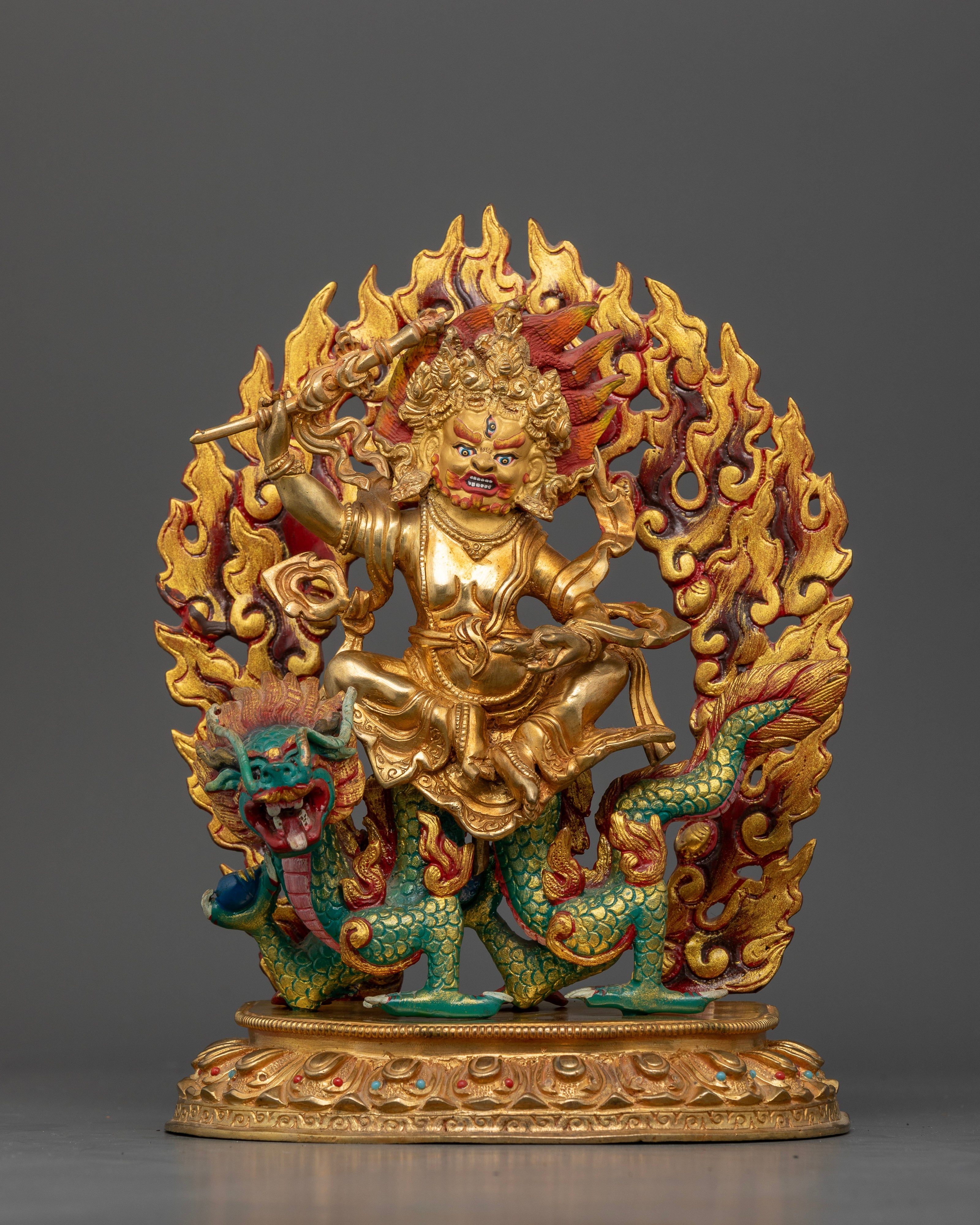 Front view White Dzambhala statue gold-gilded copper dragon-riding Nepalese deity