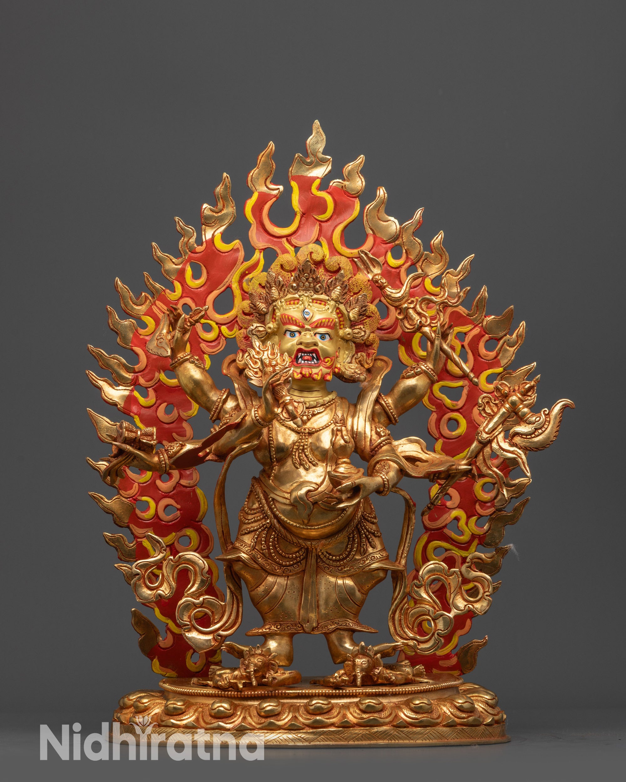 Front view White Mahakala statue with gold-gilded face and fire-gilded copper body