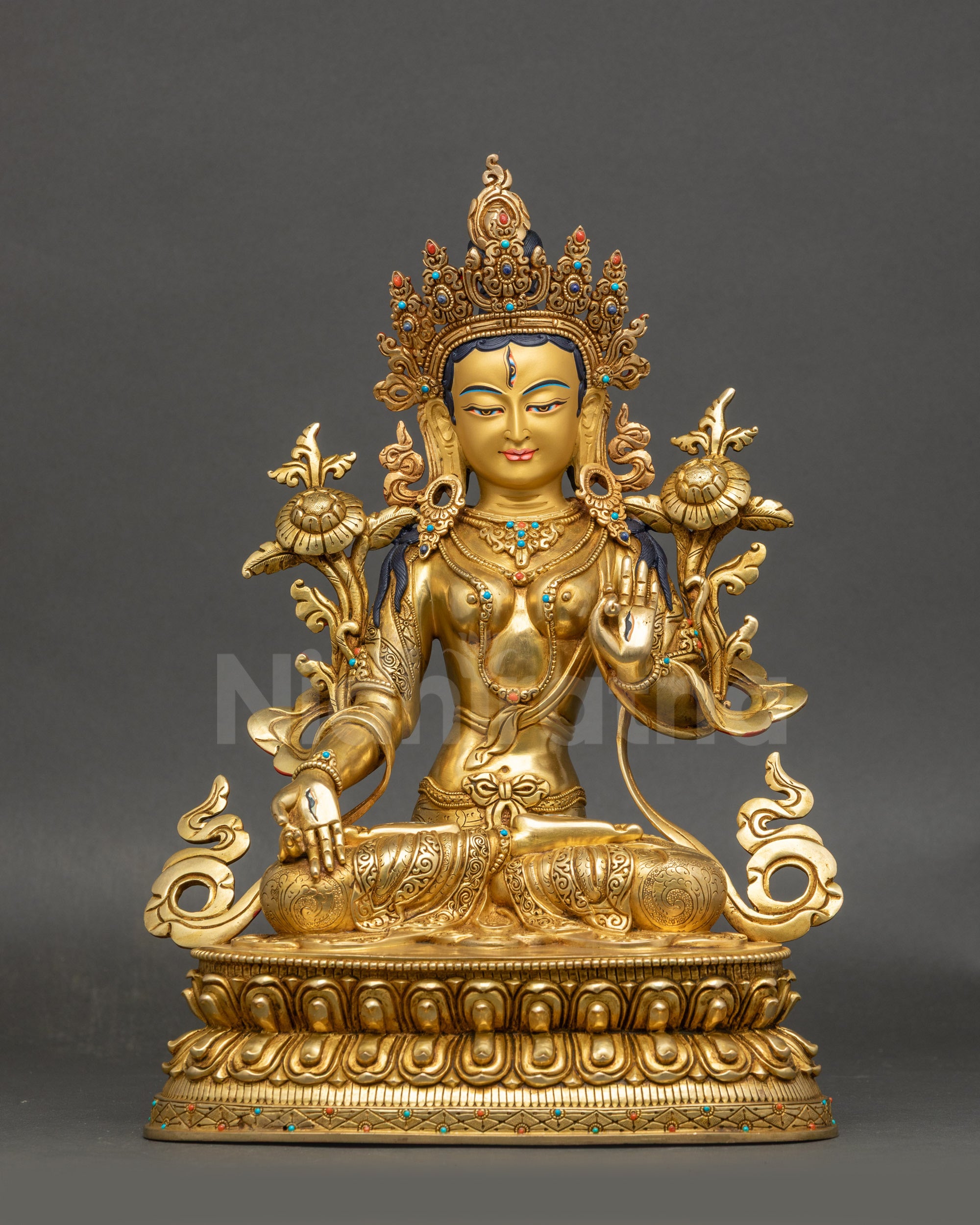 Front view White Tara meditation statue with gold fire-gilded copper surface
