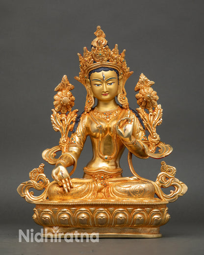 Front view White Tara statue pure gold with gold-painted face turquoise stones Nepal