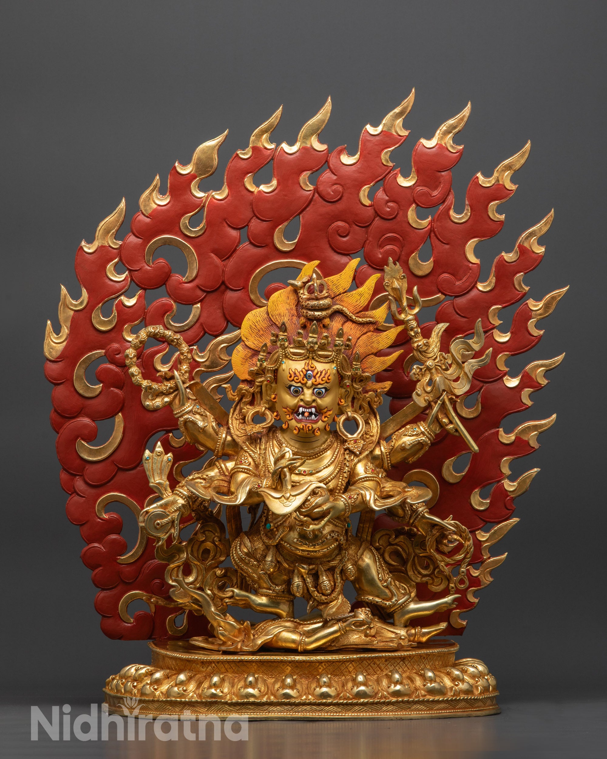 Front view Wrathful Six-Armed Mahakala Statue with gold-gilded face and flowing robe

