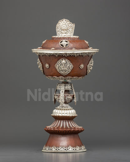 Front view handmade Tibetan Butter Lamp with silver plating, floral designs, and Buddhist symbols