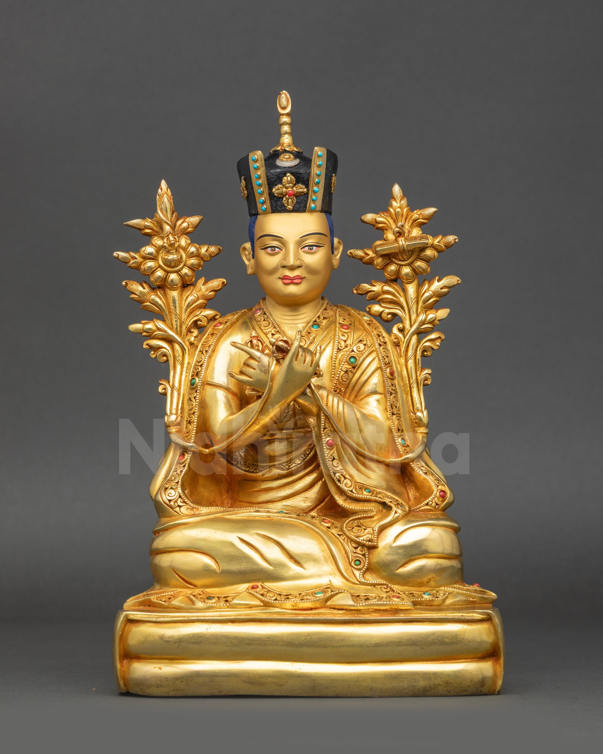 Front view of 16th Karmapa Rangjung Rigpe Dorje statue with gold face and Black Crown